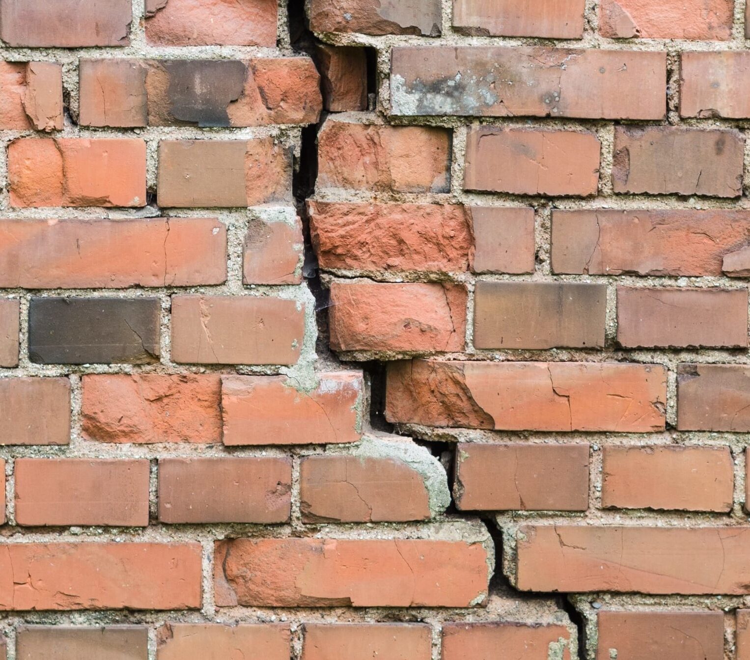 Brick facade showing uneven wear and condition